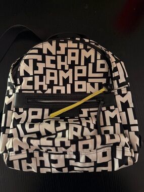 Longchamp Black and White Logo Print Backpack with Yellow Zipper Pull